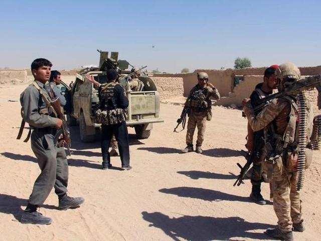 Afghan special forces and policemen prepare themselves for battle with the Taliban on the outskirts of Lashkar Gah capital of Helmand, Afghanistan. (Reuters File Photo) Afghan special forces and policemen prepare themselves for battle with the Taliban on the outskirts of Lashkar Gah capital of Helmand, Afghanistan. (Reuters File Photo)