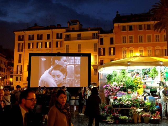 Images of actors Audrey Hepburn and Gregory Peck are displayed on a screen during the outdoor screening of the 1953 movie Roman Holiday on October 18, 2016 in Rome's Spanish Square as part of the 11th Rome Film Festival. Through October 13-23, 2016 the city of Rome hosts a series of events to celebrate the centenary of the birth of Gregory Peck, as William Wyler's Roman Holiday was the first American film to be shot entirely in Italy. (AFP) Images of actors Audrey Hepburn and Gregory Peck are displayed on a screen during the outdoor screening of the 1953 movie Roman Holiday on October 18, 2016 in Rome's Spanish Square as part of the 11th Rome Film Festival. Through October 13-23, 2016 the city of Rome hosts a series of events to celebrate the centenary of the birth of Gregory Peck, as William Wyler's Roman Holiday was the first American film to be shot entirely in Italy. (AFP)