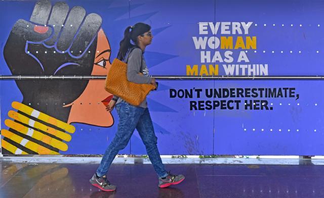 You can see Vile Parle station’s foot overbridge and ticket counters painted around themes such as women’s safety, yoga, art and child labour, among others. (Vidya Subramanian/HT Photo)