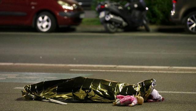 A body lies on the ground after the Bastille Day attack in Nice, France. In a controversial column, a writer in tabloid The Sun questioned if hijab-wearing TV presenter Fatima Manji should have appeared on camera after the attack “when there had been yet another shocking slaughter by a Muslim”. (Reuters) A body lies on the ground after the Bastille Day attack in Nice, France. In a controversial column, a writer in tabloid The Sun questioned if hijab-wearing TV presenter Fatima Manji should have appeared on camera after the attack “when there had been yet another shocking slaughter by a Muslim”. (Reuters)