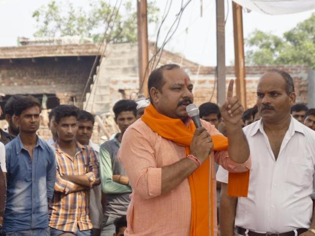 (Left to Right) BJP MLA Sangeet Som addressing the crowd at Bisada with DM NP Singh, Union minister and Gautam Buddha Nagar MP Mahesh Sharma and SSP Dharmendra Singh.