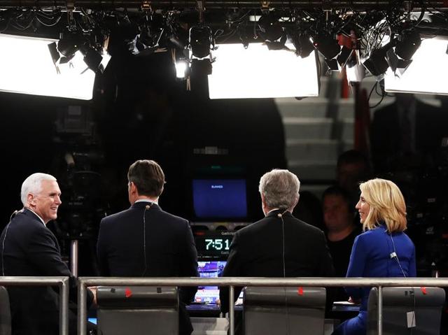 Republican vice-presidential nominee Mike Pence speaks with the CNN broadcast crew prior to the start of the third US presidential debate. (AFP Photo) Republican vice-presidential nominee Mike Pence speaks with the CNN broadcast crew prior to the start of the third US presidential debate. (AFP Photo)