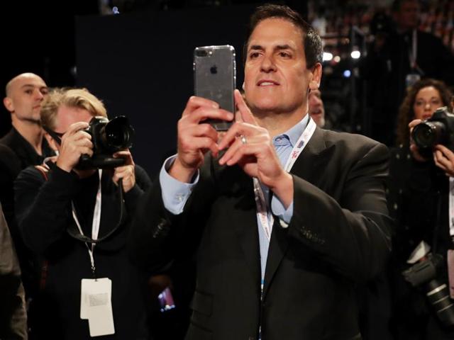 Investor and Dallas Mavericks owner Mark Cuban takes a photograph with his cellphone ahead of the debate. (AFP Photo) Investor and Dallas Mavericks owner Mark Cuban takes a photograph with his cellphone ahead of the debate. (AFP Photo)