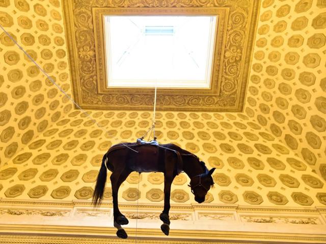 He made his name with his playful and subversive works. A hanging horse by Cattelan as part of his Paris exhibition on October 17, 2016. (AFP)