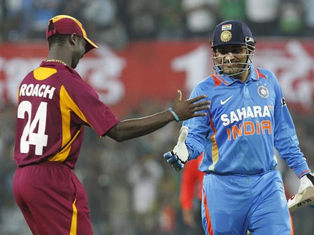 Sehwag is congratulated by West Indies’ Kemar Roach for his double century. (Santosh Harhare/HT Photo) 