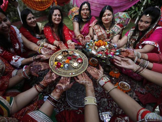 Hindu married women perform rituals on Karva Chauth festival in Ahmadabad. (AP) Hindu married women perform rituals on Karva Chauth festival in Ahmadabad. (AP)