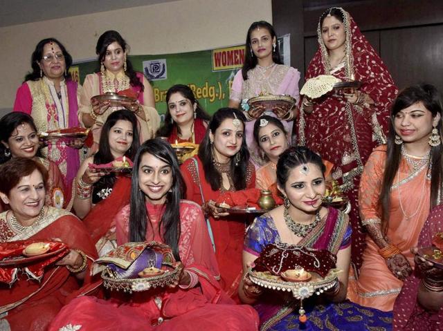 Married women perform rituals on the occasion of Karva Chauth in Patna on Wednesday. (PTI) Married women perform rituals on the occasion of Karva Chauth in Patna on Wednesday. (PTI)