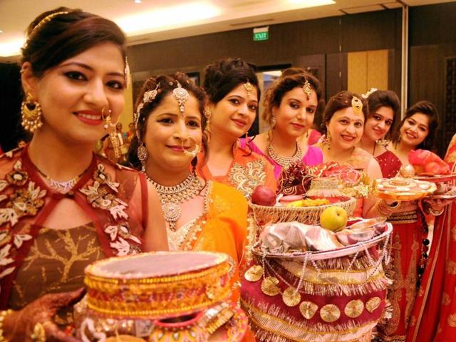 Women pose for on the occasion of Karva Chauth in Indore. (PTI) Women pose for on the occasion of Karva Chauth in Indore. (PTI)