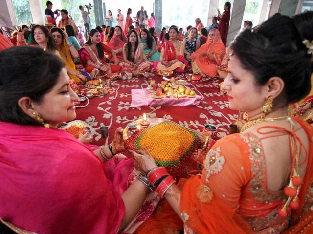 Married women perform rituals of Karva Chauth festival in Jammu. (PTI) Married women perform rituals of Karva Chauth festival in Jammu. (PTI)