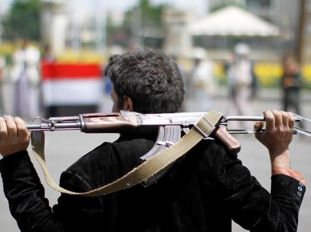An armed man loyal to the Houthi movement holds his weapon as he gathers to protest against the Saudi-backed exiled government, in the capital Sanaa. (Reuters File Photo) An armed man loyal to the Houthi movement holds his weapon as he gathers to protest against the Saudi-backed exiled government, in the capital Sanaa. (Reuters File Photo)