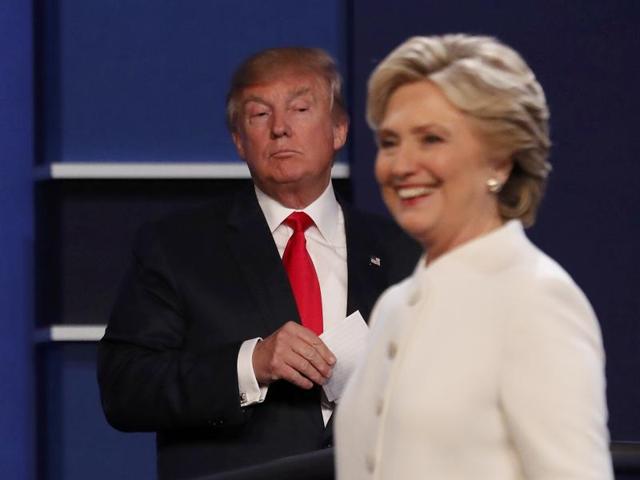 Republican US presidential nominee Donald Trump and Democratic nominee Hillary Clinton finish their third and final 2016 presidential campaign debate at UNLV in Las Vegas. (Reuters Photo) Republican US presidential nominee Donald Trump and Democratic nominee Hillary Clinton finish their third and final 2016 presidential campaign debate at UNLV in Las Vegas. (Reuters Photo)