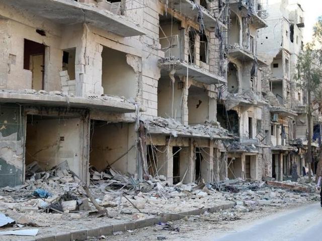 A man walks past damaged buildings in the rebel held besieged al-Sukkari neighbourhood of Aleppo, Syria on October 19. (Reuters) A man walks past damaged buildings in the rebel held besieged al-Sukkari neighbourhood of Aleppo, Syria on October 19. (Reuters)