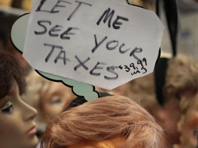 A wig and mask depicting Republican presidential nominee Donald Trump are offered for sale at Fantasy Costumes. (AFP Photo) A wig and mask depicting Republican presidential nominee Donald Trump are offered for sale at Fantasy Costumes. (AFP Photo)