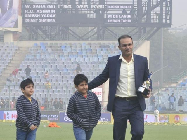 Virender Sehwag with his two sons after he was facilitated by the BCCI at Feroz Shah Kotla before the start the of India South Africa first Test match in New Delhi on December 3, 2015. Sehwag was facilitated following his international retirement before the start of the series. (Vipin Kumar/HT Photo) 