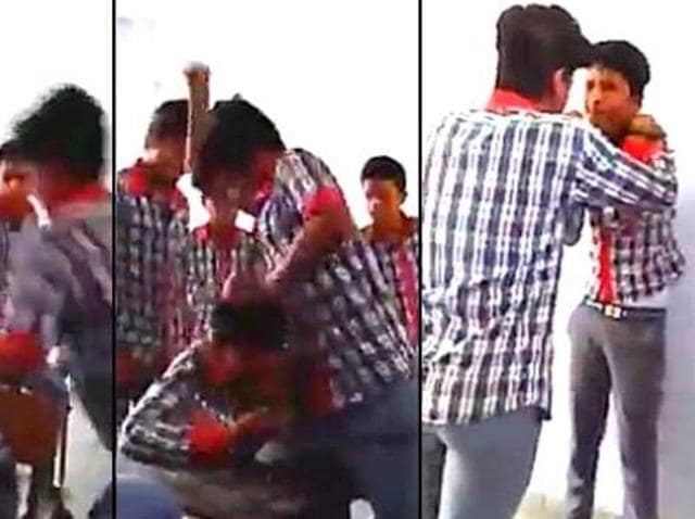 The still shows school boys ruthlessly thrashing their classmate in a classroom while others watch. A video of the violence was posted to social media. (Video grab) The still shows school boys ruthlessly thrashing their classmate in a classroom while others watch. A video of the violence was posted to social media. (Video grab)
