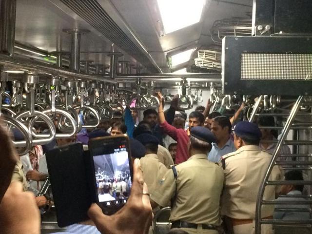 A commuter records Wednesday’s incident in the Churchgate-Dahanu train at Virar station. (Surendra Negi/HT) A commuter records Wednesday’s incident in the Churchgate-Dahanu train at Virar station. (Surendra Negi/HT)