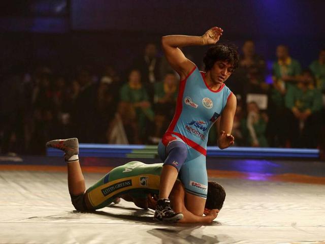 Babita Kumari with gold medal after medal ceremony of the women's Freestyle Wrestling 55kg Final match at the Scottish Exhibition Conference Centre during the Commonwealth Games 2014 in Glasgow, Scotland.(PTI)