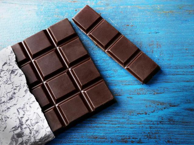 Dark chocolate: Instead of reaching for store-bought chocolate bars or biscuits when hunger strikes, try taking a little time to prepare your own home-made snacks. Try filling a small box with two squares of dark chocolate per day or crystallised ginger. (Shutterstock) Dark chocolate: Instead of reaching for store-bought chocolate bars or biscuits when hunger strikes, try taking a little time to prepare your own home-made snacks. Try filling a small box with two squares of dark chocolate per day or crystallised ginger. (Shutterstock)