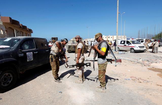 Fighters of Libyan forces allied with the UN-backed government hold their weapons in Sirte at the eastern frontline of fighting with Islamic State militants (Reuters) Fighters of Libyan forces allied with the UN-backed government hold their weapons in Sirte at the eastern frontline of fighting with Islamic State militants (Reuters)