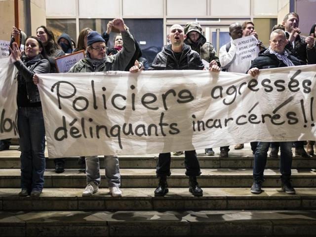 Police officers demonstrate for the third night in a row, during an unauthorized protest in front of the courthouse, in Marseille, southern France. (AP Photo) Police officers demonstrate for the third night in a row, during an unauthorized protest in front of the courthouse, in Marseille, southern France. (AP Photo)