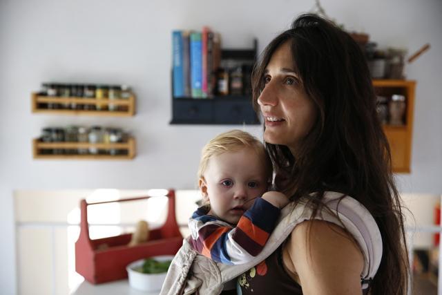 In this October 20, 2016 photo, vegan mother Fulvia Serra carries her one-year-old baby, Sebastiano, at home in Colorado, US. Serra, originally from Italy, and her husband, Scott, are raising their son vegan. (AP)