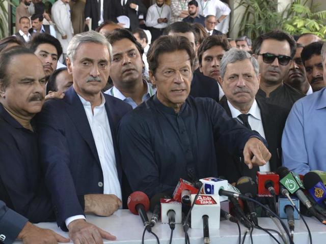 Pakistan's cricketer turned politician Imran Khan, center, talks to journalists outside the Supreme Court in Islamabad on Thursday. (AP Photo) Pakistan's cricketer turned politician Imran Khan, center, talks to journalists outside the Supreme Court in Islamabad on Thursday. (AP Photo)