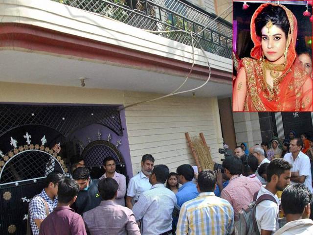 People gather after Lalita (inset), wife of national level Kabaddi player Rohit Kumar was found hanging at her home in Nangloi, New Delhi.(PTI Photo) People gather after Lalita (inset), wife of national level Kabaddi player Rohit Kumar was found hanging at her home in Nangloi, New Delhi.(PTI Photo)