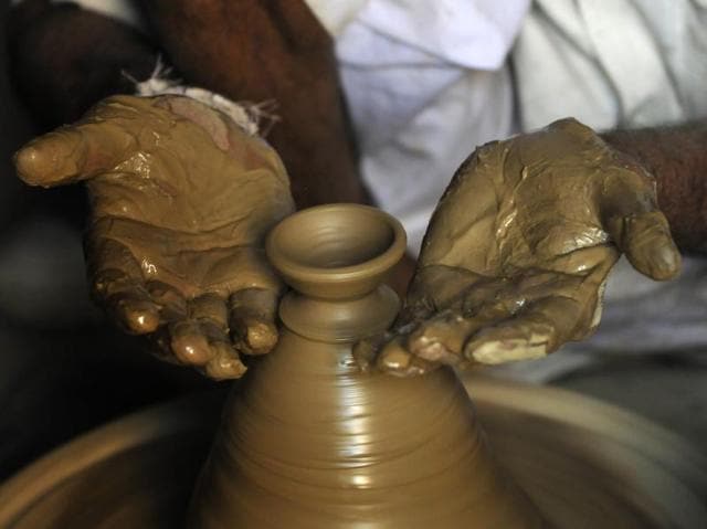 Wet clay is moulded in the expert hands of the potters, many of whom have learnt the craft from their forefathers. (Sunil Ghosh / HT PHOTO)