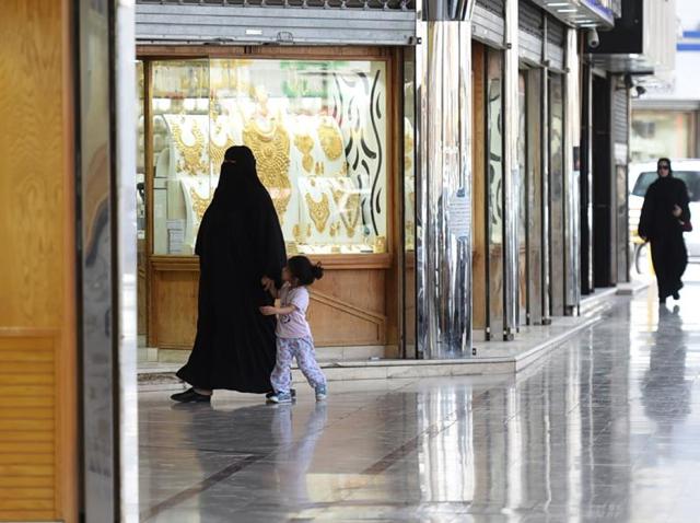 Saudi women walk past jewellery shops at Tiba market in Riyadh. Since 2014 global oil prices have collapsed by more than half, leaving Saudi Arabia with a record deficit last year. (AFP File Photo) Saudi women walk past jewellery shops at Tiba market in Riyadh. Since 2014 global oil prices have collapsed by more than half, leaving Saudi Arabia with a record deficit last year. (AFP File Photo)