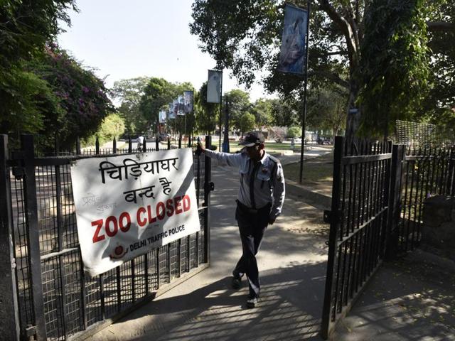 A guard on the duty of the entrance gate of Delhi Zoo which is closed due to Birds flu in New Delhi. (Virendra Singh Gosain/HT PHOTO)