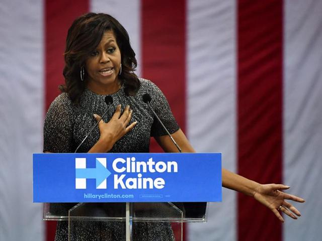 First Lady Michelle Obama speaks to a crowd of supporters as she campaigns for the Democratic Party presidential nominee Hillary Clinton at the Convention Center, in Phoenix, Arizona. (AFP Photo) First Lady Michelle Obama speaks to a crowd of supporters as she campaigns for the Democratic Party presidential nominee Hillary Clinton at the Convention Center, in Phoenix, Arizona. (AFP Photo)