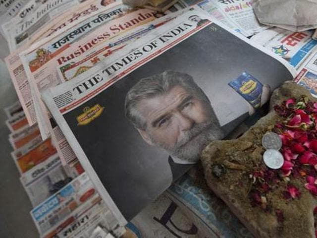 A newspaper with a front page advertisment of former 007 star Pierce Brosnan endorsing a mouth freshener. (AFP file) A newspaper with a front page advertisment of former 007 star Pierce Brosnan endorsing a mouth freshener. (AFP file)