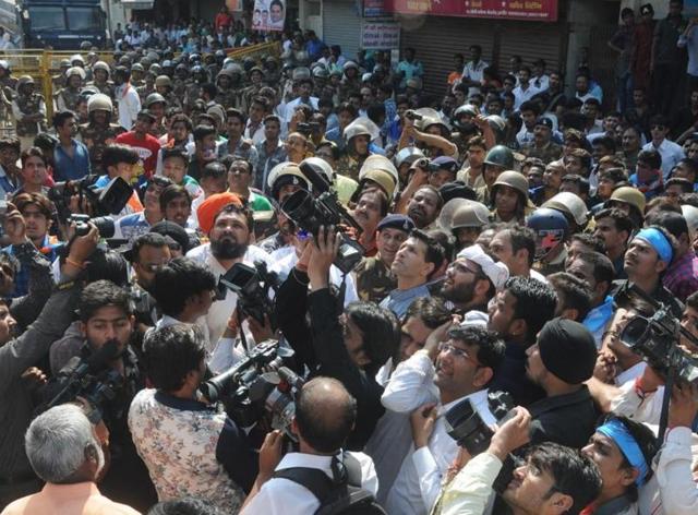 Mediapersons outside the DC office in Indore where the NSUI workers had laid a siege.(Shankar Mourya/ HT Photo)
