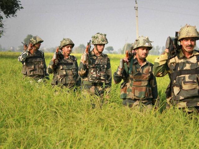 Border Security Force (BSF) men patrol near International Border in RS Pura Sector in Jammu on Wednesday. (PTI) Border Security Force (BSF) men patrol near International Border in RS Pura Sector in Jammu on Wednesday. (PTI)