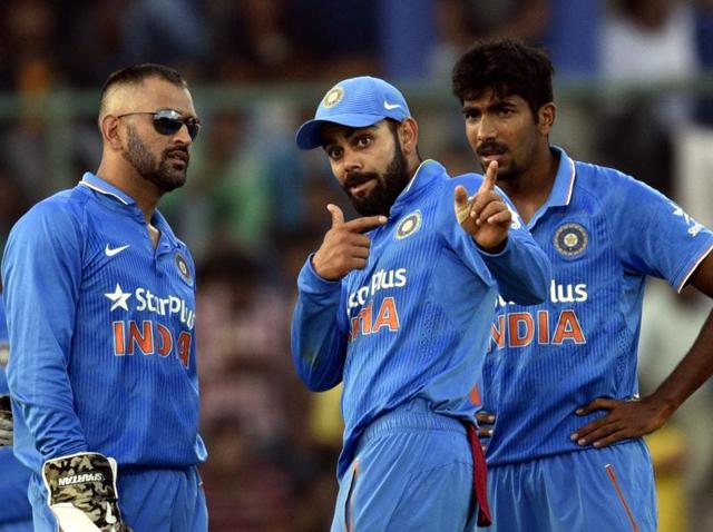 Indian skipper MS Dhoni with Virat Kohli and Jasprit Bumrah against New Zealand during the second ODI at Feroz Shah Kotla ground in New Delhi on October 20, 2016. (Mohd Zakir/HT PHOTO)