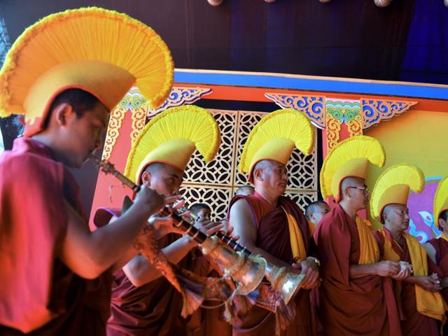 The local legend says that once in the 17th century, a Tibetan monk Mera Lama saw a beautiful horse wandering in the valley. Struck by its beauty, he tried to capture it but the horse disappeared. Buddhist monks performing at the festival. (AFP)