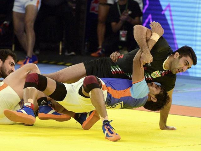 Indian players trying to hold Irani player during final match of Kabaddi World Cup 2016 in Ahmedabad.(PTI Photo)