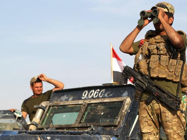 Iraqi forces units hold a position near the village of Tall al-Tibah, some 30 kilometres south of Mosul, during an operation to retake the main hub city from the Islamic State (IS) group jihadists on October 21, 2016. (AFP) Iraqi forces units hold a position near the village of Tall al-Tibah, some 30 kilometres south of Mosul, during an operation to retake the main hub city from the Islamic State (IS) group jihadists on October 21, 2016. (AFP)