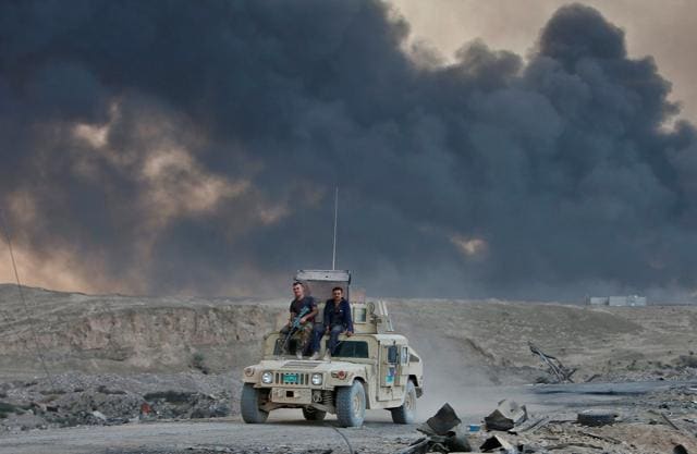 An Iraqi army vehicle is seen during an operation to attack Islamic State militants in Mosul, in Qayyara, Iraq. (REUTERS) An Iraqi army vehicle is seen during an operation to attack Islamic State militants in Mosul, in Qayyara, Iraq. (REUTERS)
