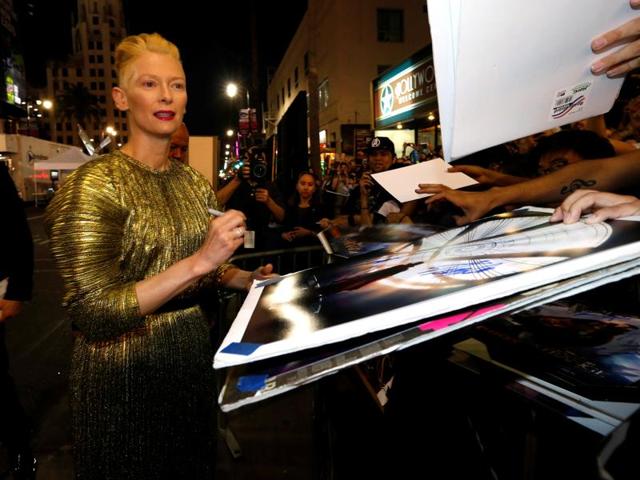 Cast member Tilda Swinton, who plays The Ancient One, signs autographs at the premiere of Doctor Strange. (REUTERS) 