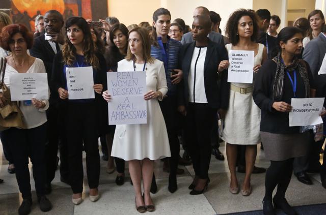 United Nations staff stand in a silent protest against a UN meeting to designate Wonder Woman as an ‘Honorary Ambassador for the Empowerment of Women and Girls’. (AP Photo)