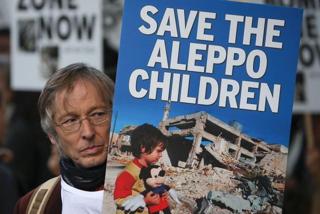 A demonstrator holds a placard that reads "Save The Aleppo Children" during a protest calling on the British government to take action to protect the children of the Syrian city of Aleppo outside Downing Street in central London on October 22. (AFP Photo) A demonstrator holds a placard that reads "Save The Aleppo Children" during a protest calling on the British government to take action to protect the children of the Syrian city of Aleppo outside Downing Street in central London on October 22. (AFP Photo)
