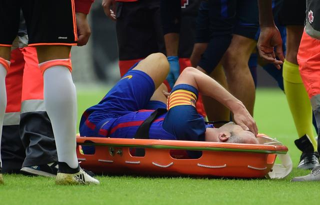 The Spain international Andres Iniesta was carried off on a stretcher crying in pain following. (AP) The Spain international Andres Iniesta was carried off on a stretcher crying in pain following. (AP)