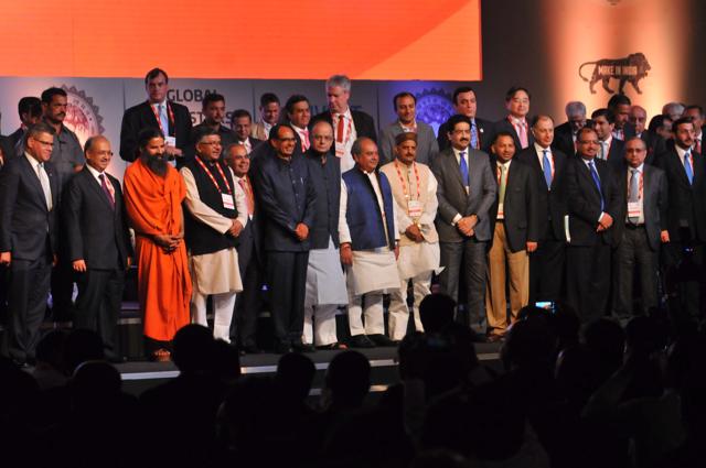 INDORE, India - Oct. 22, 2016:Yoga guru Baba Ramdev meets Union finance minister Arun Jaitley as chiefe minister Shivraj Singh Chouhan looks during the inaugural session of Global Investors summit 2016 at Brilliant convention centre in INDORE, India, on Saturday, October 22, 2016.(Shankar Mourya/ HT Photo Photo)