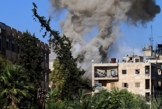 Smoke rises from reported opposition fire from buildings in an eastern government-held neighbourhood of the northern Syrian city of Aleppo on October 20 as clashes erupted in an area designated as a ‘humanitarian corridor’. (AFP Photo) Smoke rises from reported opposition fire from buildings in an eastern government-held neighbourhood of the northern Syrian city of Aleppo on October 20 as clashes erupted in an area designated as a ‘humanitarian corridor’. (AFP Photo)
