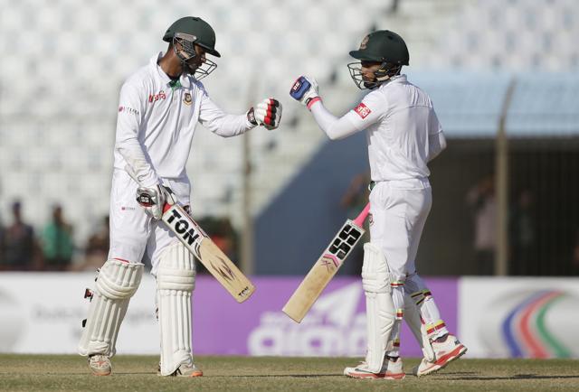Bangladesh's captain Mushfiqur Rahim, right, and teammate Sabbir Rahman celebrate a boundary shot during the fourth day of their first cricket test match against England in Chittagong, Bangladesh, Sunday, Oct. 23, 2016. (AP Photo/A.M. Ahad) (AP) Bangladesh's captain Mushfiqur Rahim, right, and teammate Sabbir Rahman celebrate a boundary shot during the fourth day of their first cricket test match against England in Chittagong, Bangladesh, Sunday, Oct. 23, 2016. (AP Photo/A.M. Ahad) (AP)