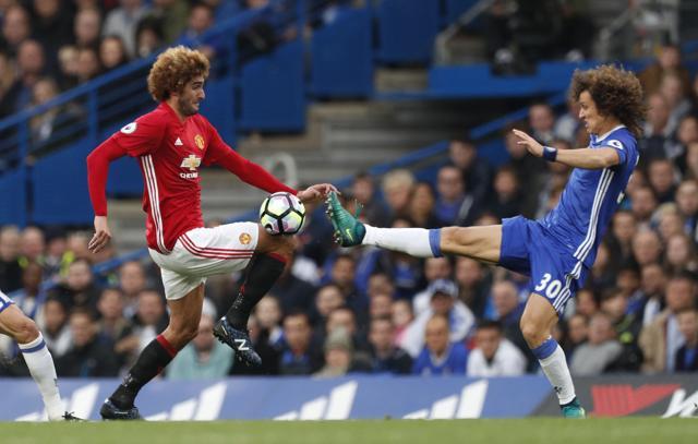 Luiz, right, was fortunate to not be sent off for his foul on Fellaini. (REUTERS) Luiz, right, was fortunate to not be sent off for his foul on Fellaini. (REUTERS)
