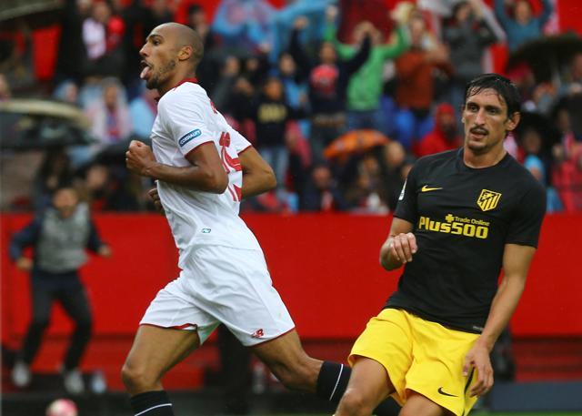 Sevilla's Steven N'Zonzi, left, sticks his tongue out in celebration after scoring against Atletico Madrid. (REUTERS) Sevilla's Steven N'Zonzi, left, sticks his tongue out in celebration after scoring against Atletico Madrid. (REUTERS)
