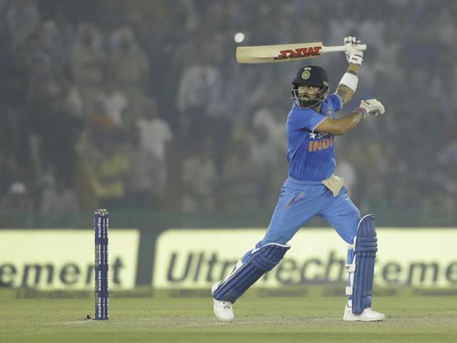Virat takes his hand off the bat during the follow-through of his shot. (AP)