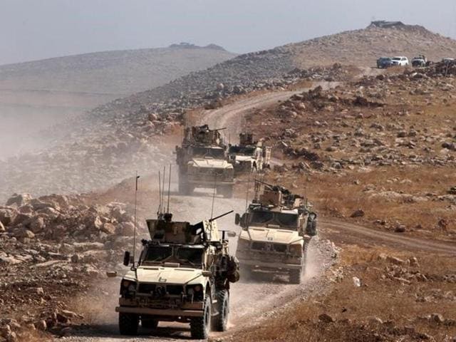A convoy of armoured vehicles belonging to international coalition troops drive during the operation against Islamic State militants outside the town of Naweran near Mosul, Iraq. (Reuters) A convoy of armoured vehicles belonging to international coalition troops drive during the operation against Islamic State militants outside the town of Naweran near Mosul, Iraq. (Reuters)